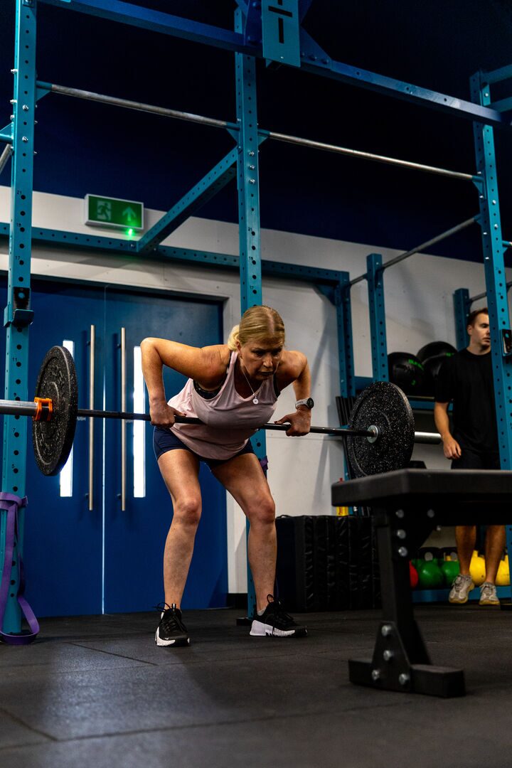 Woman strength training during midlife transition